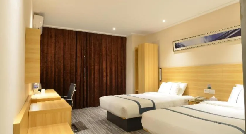 Bed in City Comfort Inn Huanggang Qichun Exhibition Center