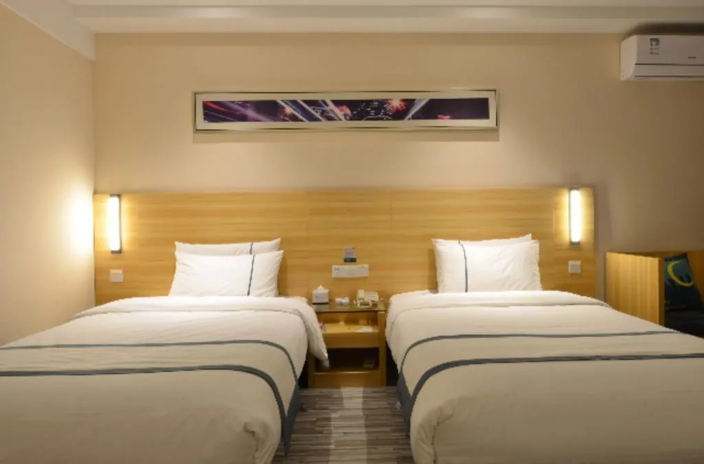 Bed in City Comfort Inn Huanggang Qichun Exhibition Center