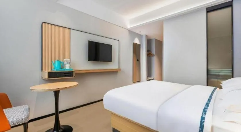 Bed in City Comfort Inn Wuhan International Expo Center Qianjin Village Metro Station