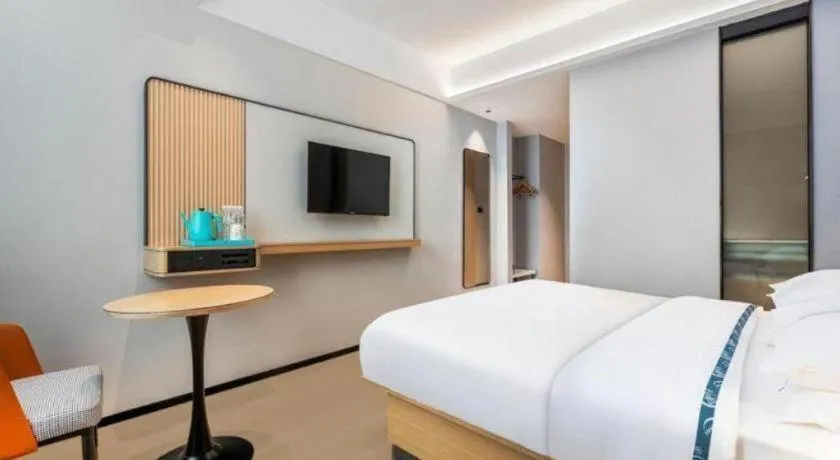 Bed in City Comfort Inn Wuhan International Expo Center Qianjin Village Metro Station