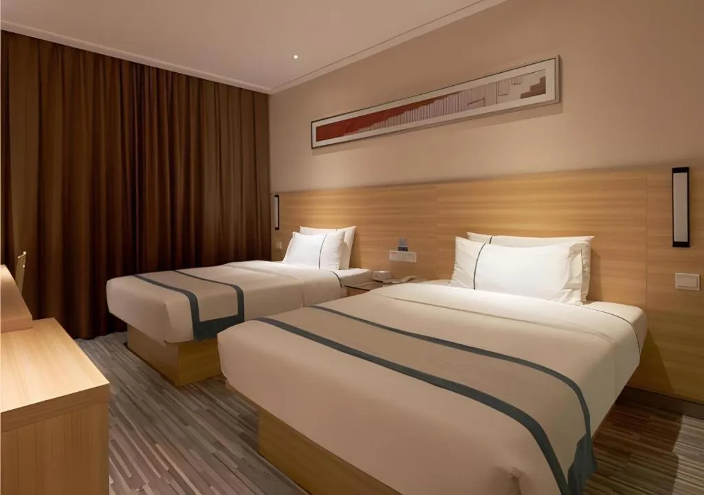 Bed in City Comfort Inn Liuzhou Wuxing Walking Street