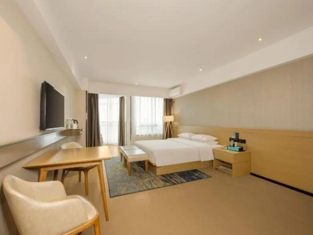 Bed in City Comfort Inn Liuzhou Wuxing Walking Street Zhonghuan Tower