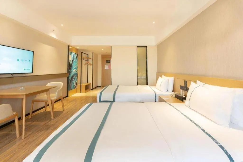 Bed in City Comfort Inn Liuzhou Wuxing Walking Street Zhonghuan Tower