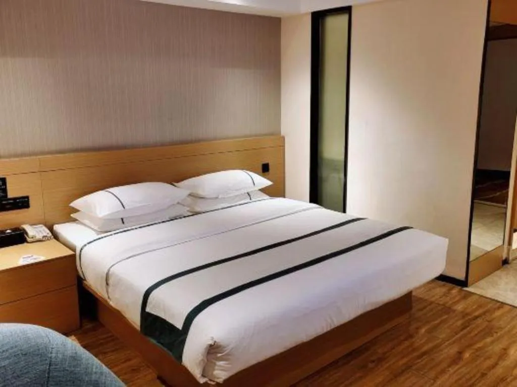 Bed in City Comfort Inn Liuzhou Wuxing Walking Street Zhonghuan Tower