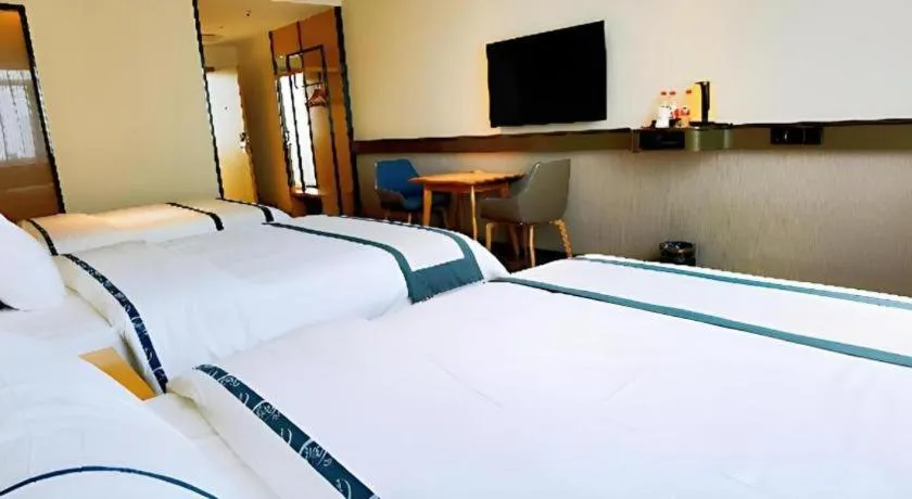Bed in City Comfort Inn Hezhou Huangyao Ancient Town