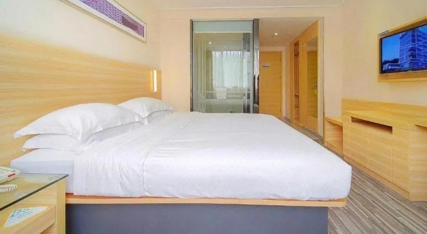 Bed in City Comfort Inn Zhongshan Dongsheng One Plus One