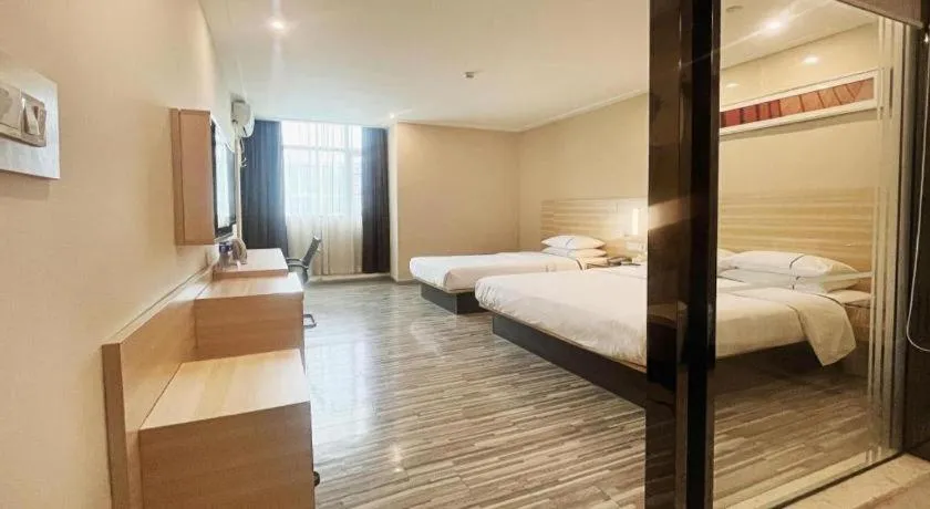 Bed in City Comfort Inn Zhongshan Dongsheng One Plus One