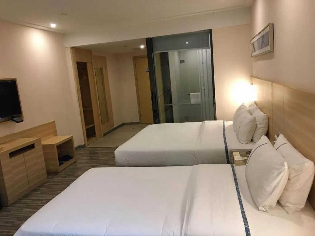 Bed in City Comfort Inn Zhongshan Dongsheng One Plus One
