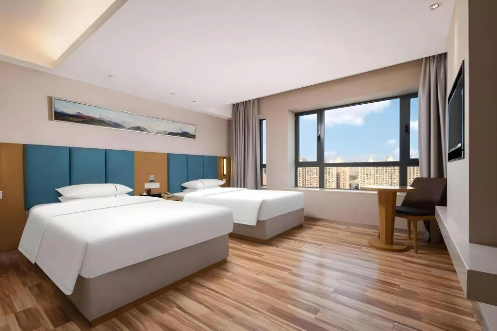 Bed in City Comfort Inn Jingzhou Wanda Plaza