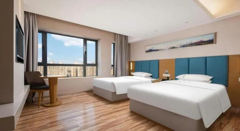 Bed in City Comfort Inn Jingzhou Wanda Plaza