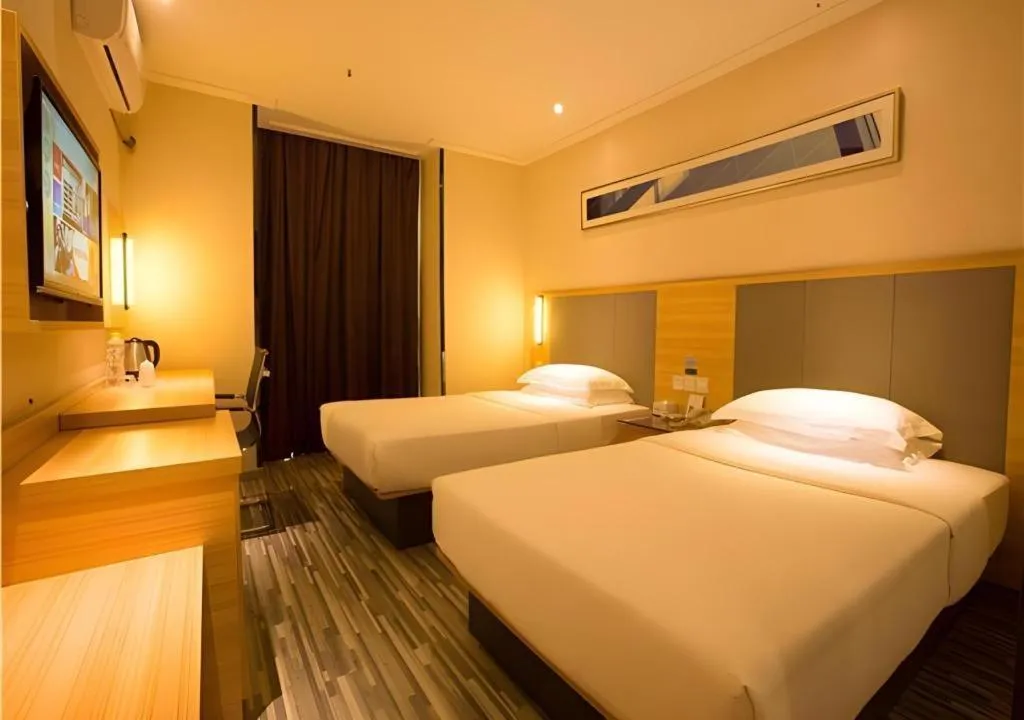 Bed in City Comfort Inn Hechi Chengxi Avenue