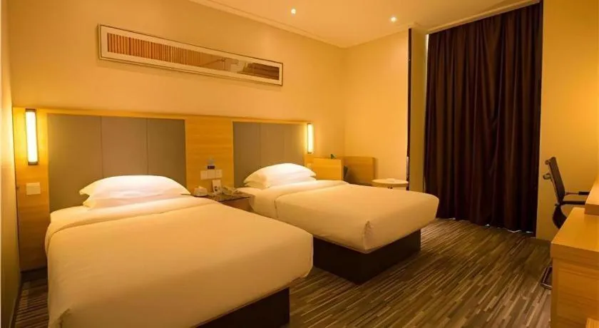 Bed in City Comfort Inn Hechi Chengxi Avenue