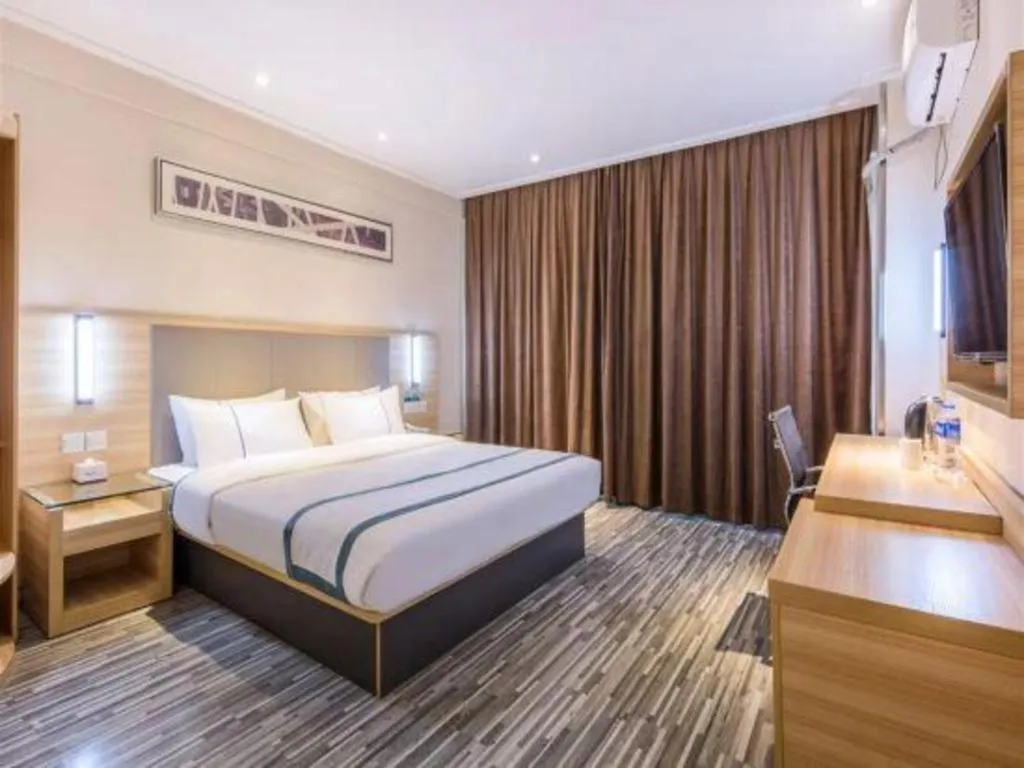 Bed in City Comfort Inn Zhongshan Xiaolan Xinduhui Gymnasium