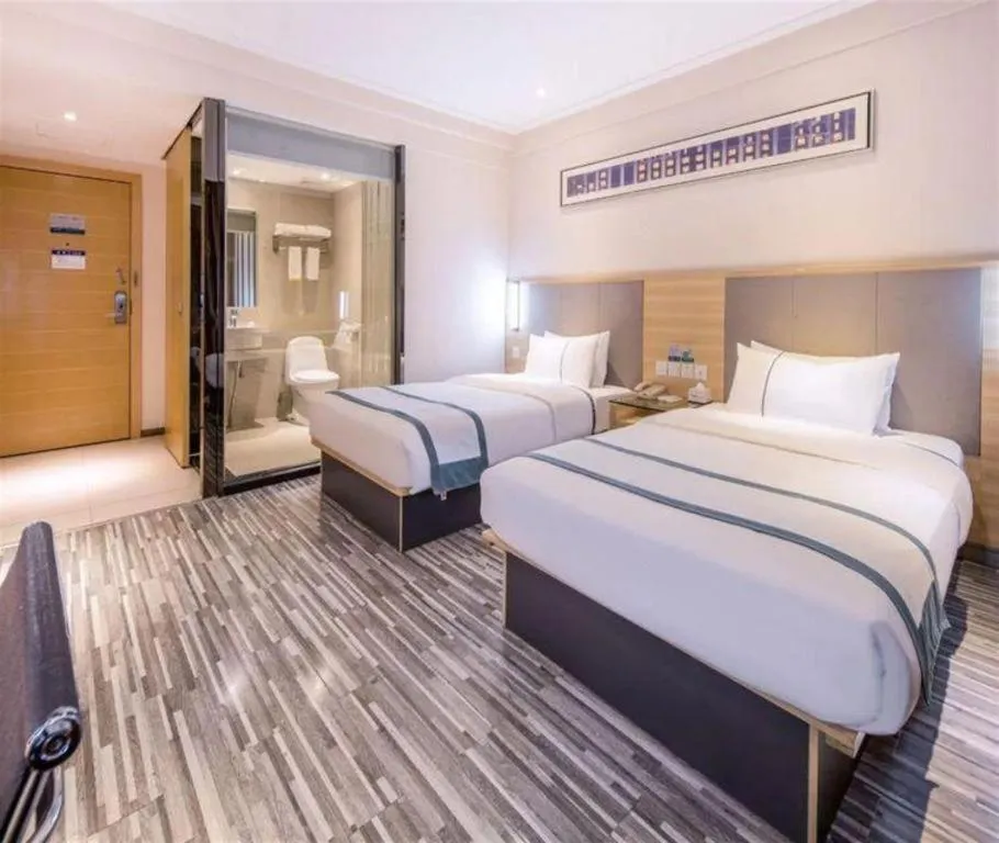 Bed in City Comfort Inn Zhongshan Xiaolan Xinduhui Gymnasium