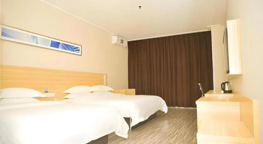 Bed in City Comfort Inn Zhongshan Xiaolan Xinduhui Gymnasium