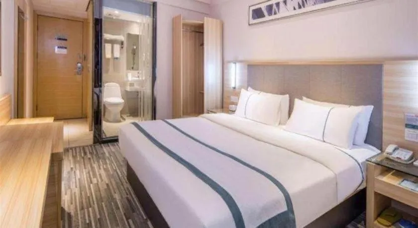 Bed in City Comfort Inn Zhongshan Xiaolan Xinduhui Gymnasium