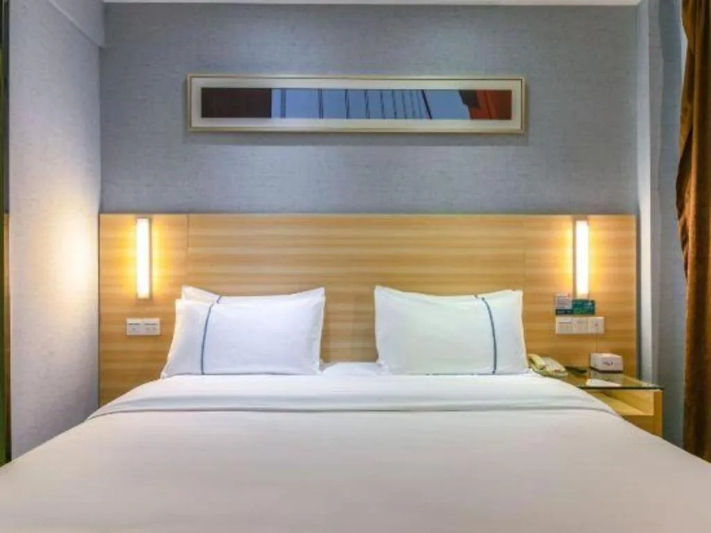 Bed in City Comfort Inn Zhongshan Xiaolan Xinduhui Gymnasium