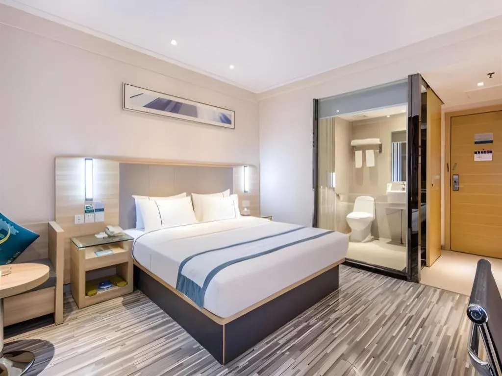 Bed in City Comfort Inn Zhongshan Xiaolan Xinduhui Gymnasium