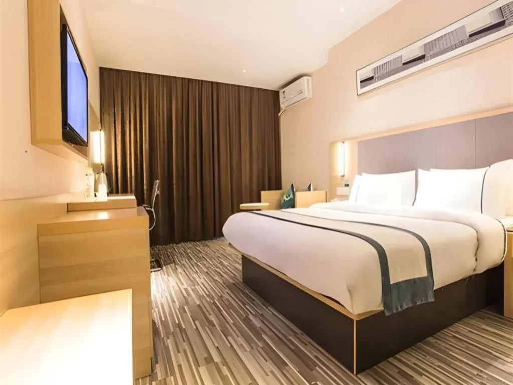 Bed in City Comfort Inn Zhongshan Xiaolan Xinduhui Gymnasium