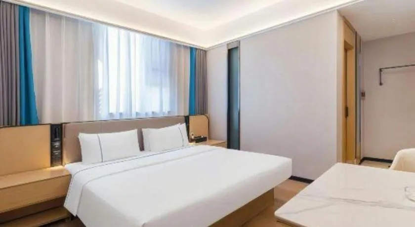 Bed in City Comfort Inn Huanggang Wuxue Bus Center