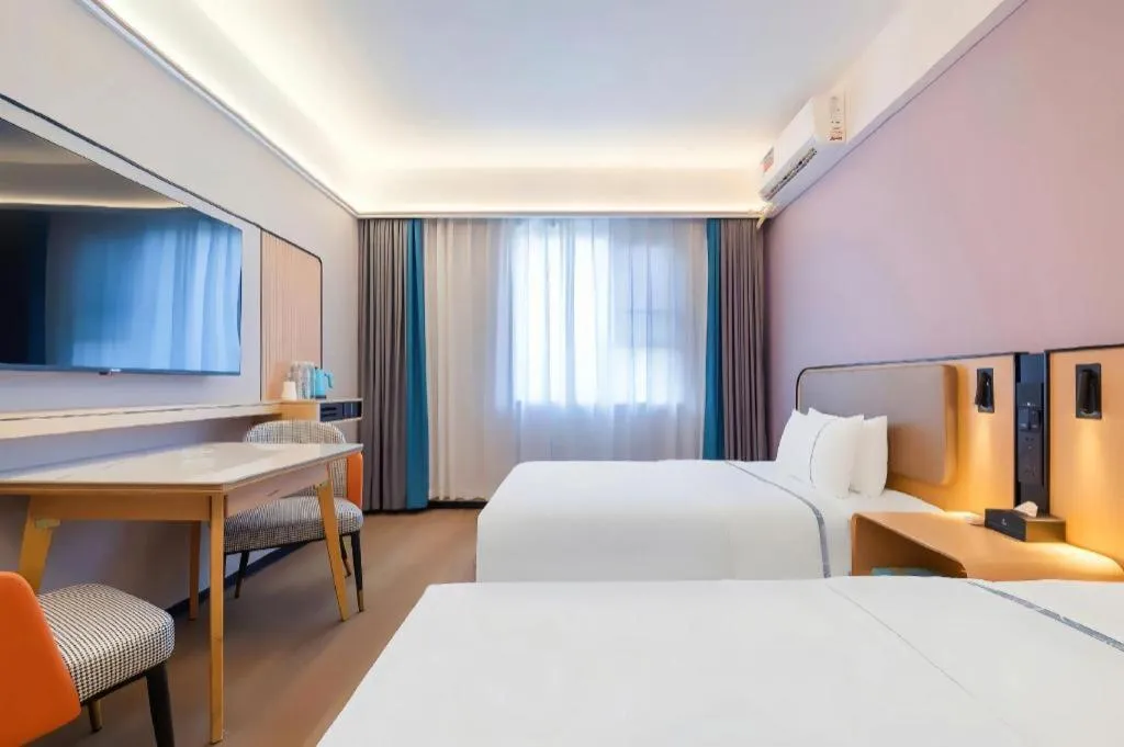 Bed in City Comfort Inn Huanggang Wuxue Bus Center