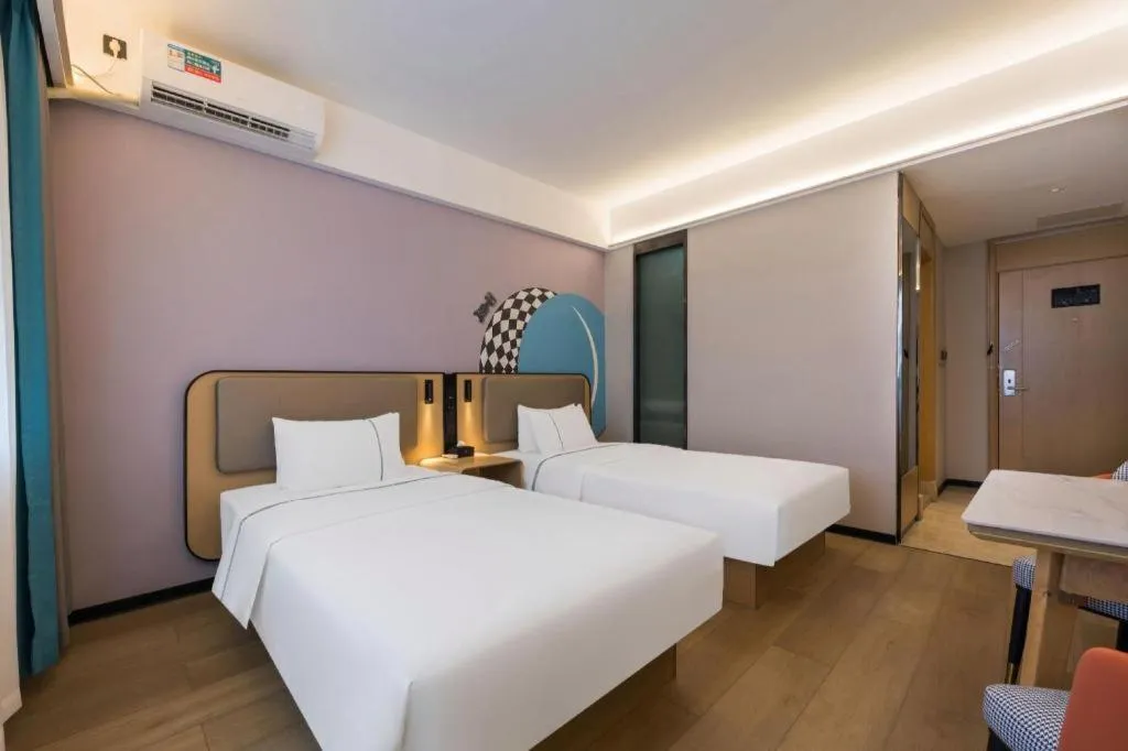 Bed in City Comfort Inn Huanggang Wuxue Bus Center