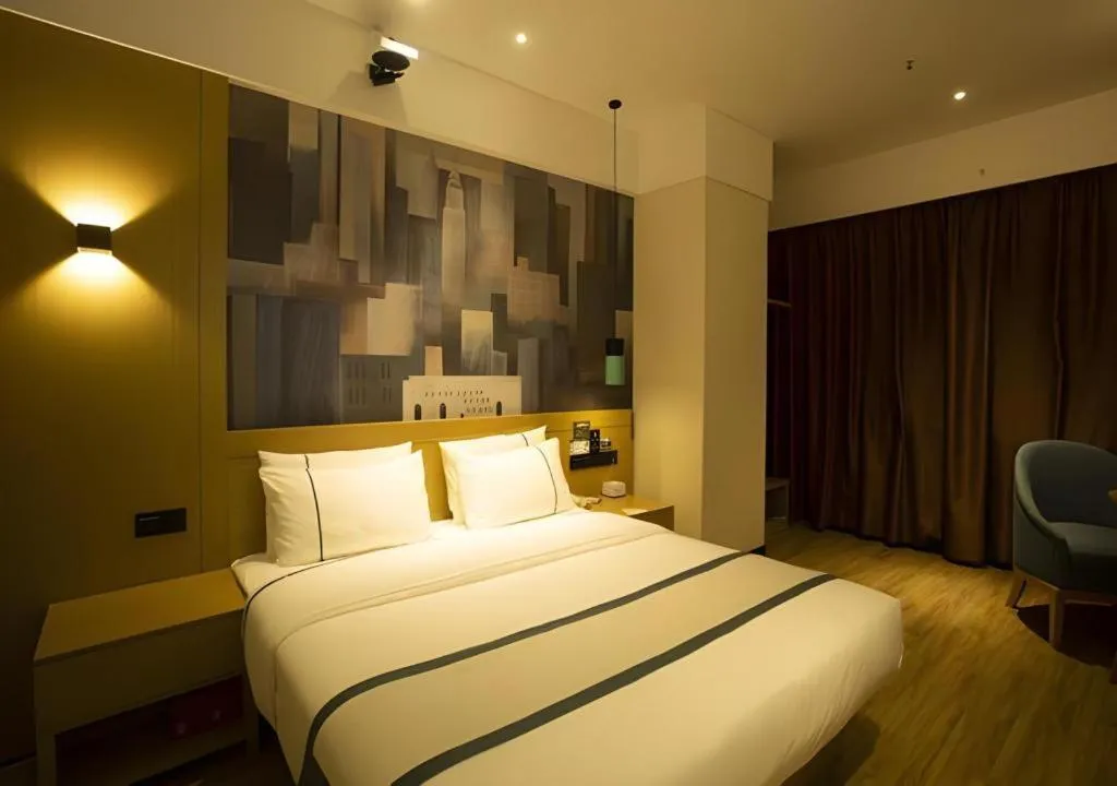 Bed in City Comfort Inn Huanggang Wuxue Bus Center