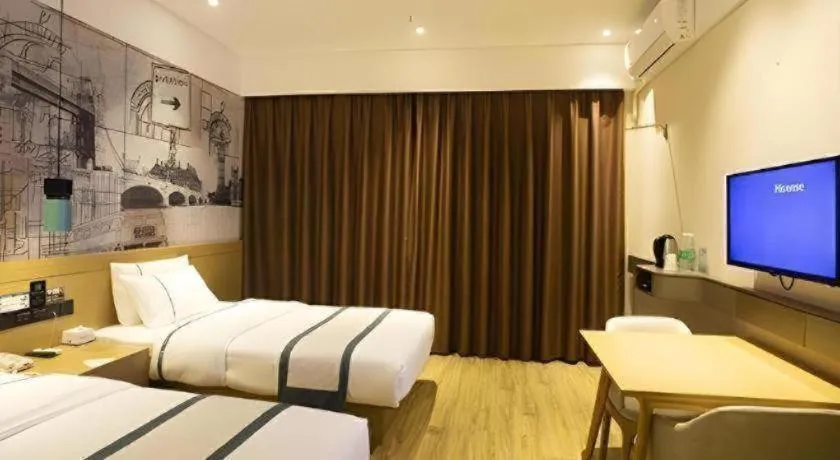 Bed in City Comfort Inn Huanggang Wuxue Bus Center