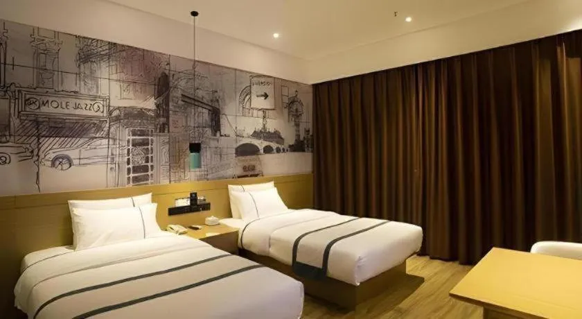 Bed in City Comfort Inn Huanggang Wuxue Bus Center