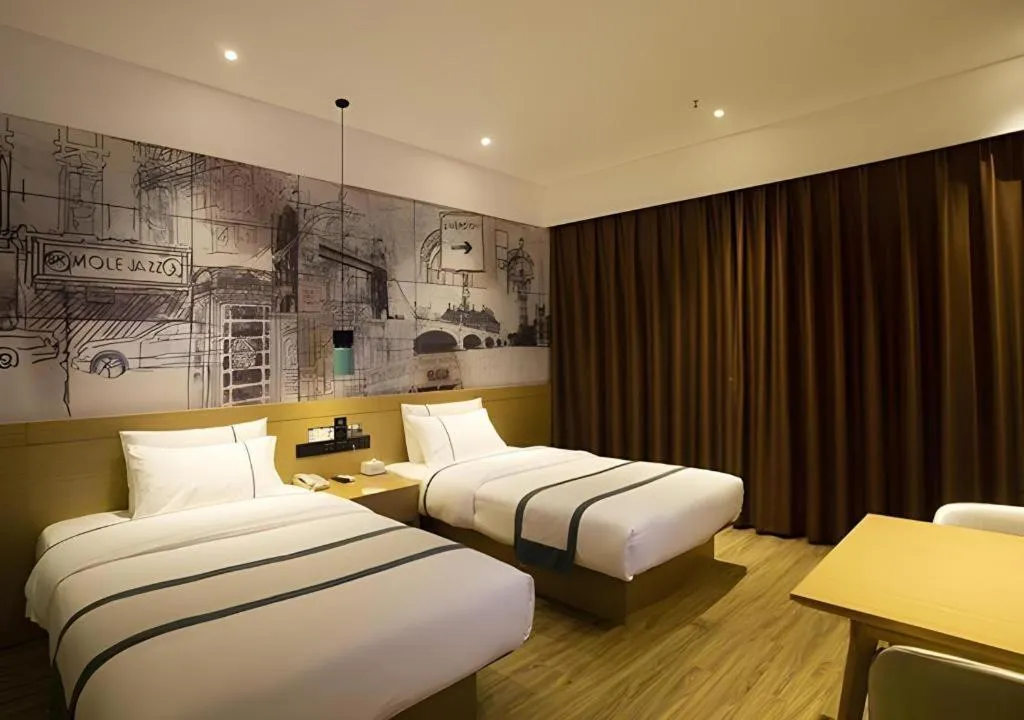 Bed in City Comfort Inn Huanggang Wuxue Bus Center