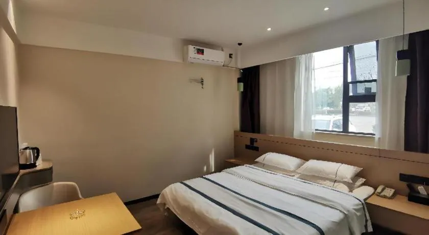 Bed in City Comfort Inn Huanggang Wuxue Bus Center