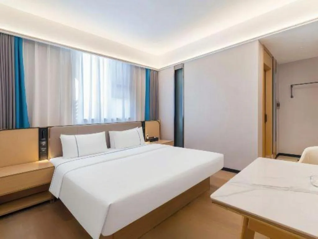 Bed in City Comfort Inn Huanggang Wuxue Bus Center