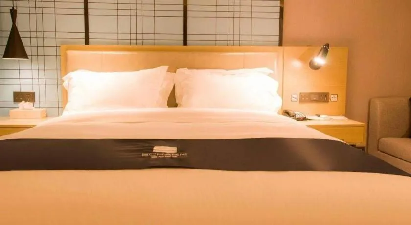 Bed in Echarm Hotel Huangshi Yingbin Avenue