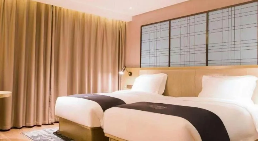 Bed in Echarm Hotel Huangshi Yingbin Avenue