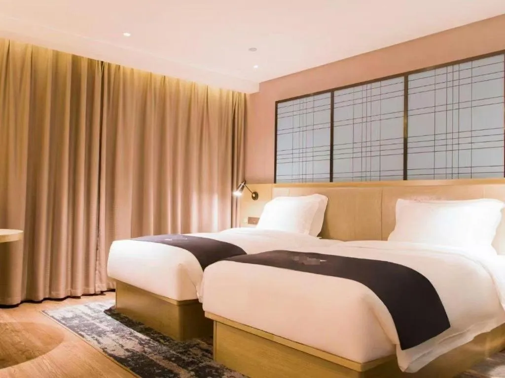 Bed in Echarm Hotel Huangshi Yingbin Avenue