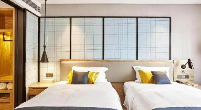 Bed in Echarm Hotel Huangshi Yingbin Avenue