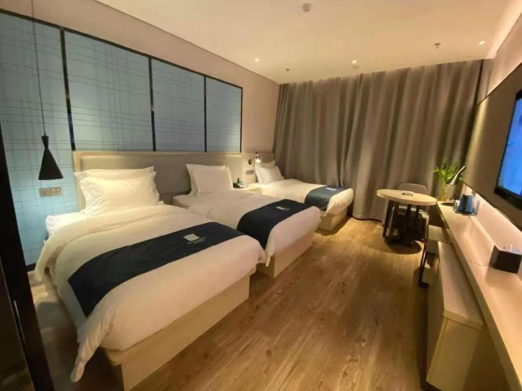 Bed in Echarm Hotel Changchun Jiutai District Government Railway Station