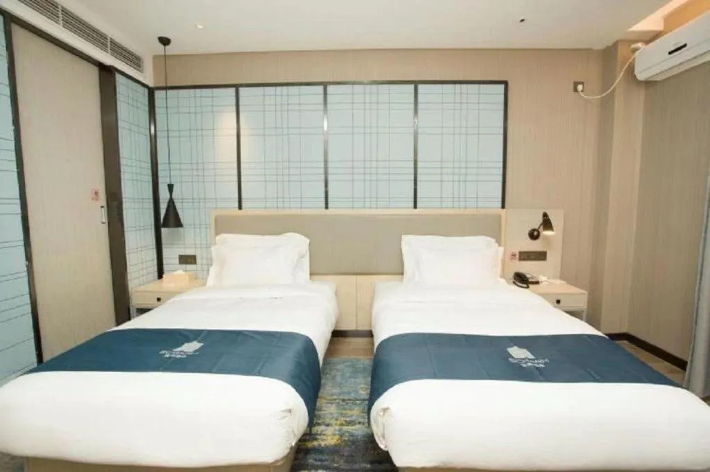 Bed in Echarm Hotel Changchun Jiutai District Government Railway Station