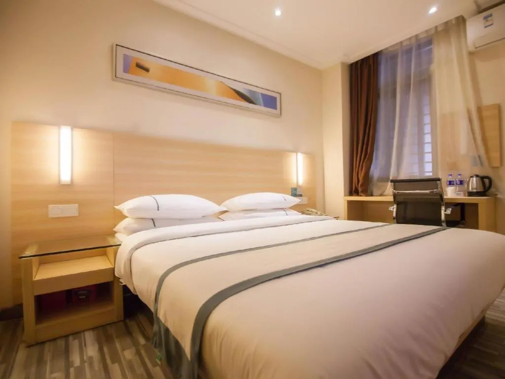 Bed in City Comfort Inn Yichang Dongshan Three Gorges University Shuiyuecheng