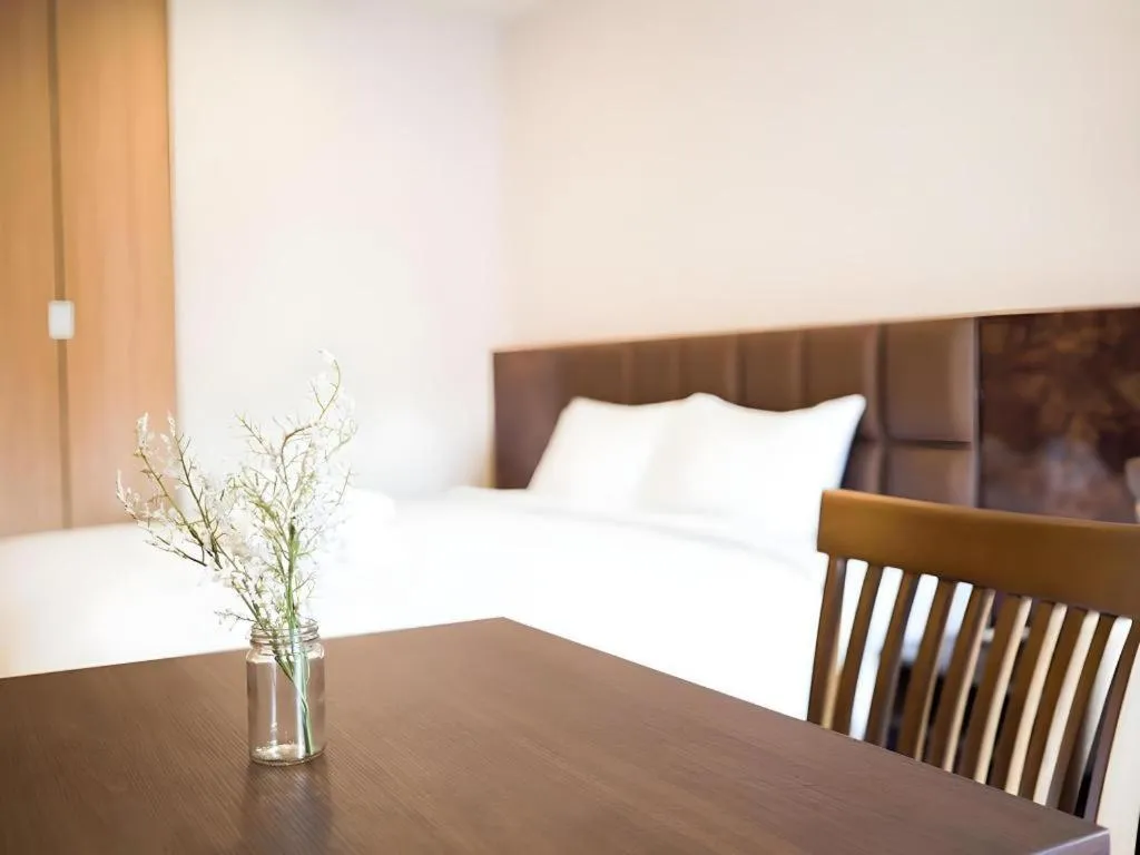 Bed in B2 Amata Nakorn Premier Hotel