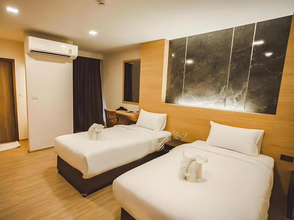 Bed in B2 Amata Nakorn Premier Hotel