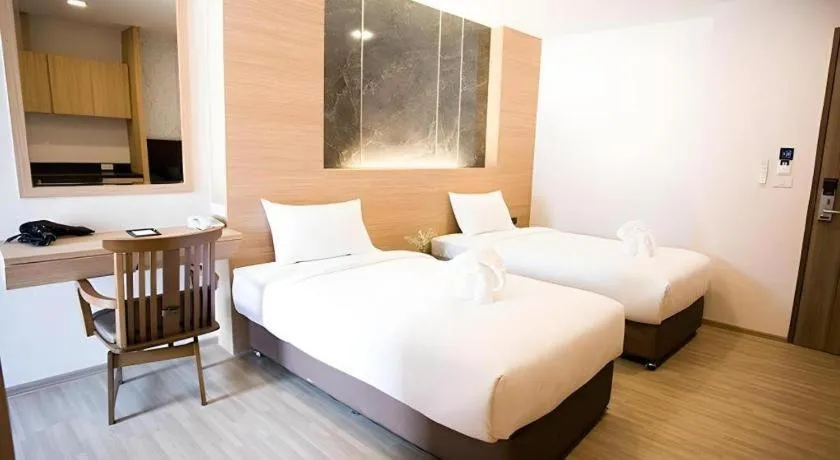 Bed in B2 Amata Nakorn Premier Hotel