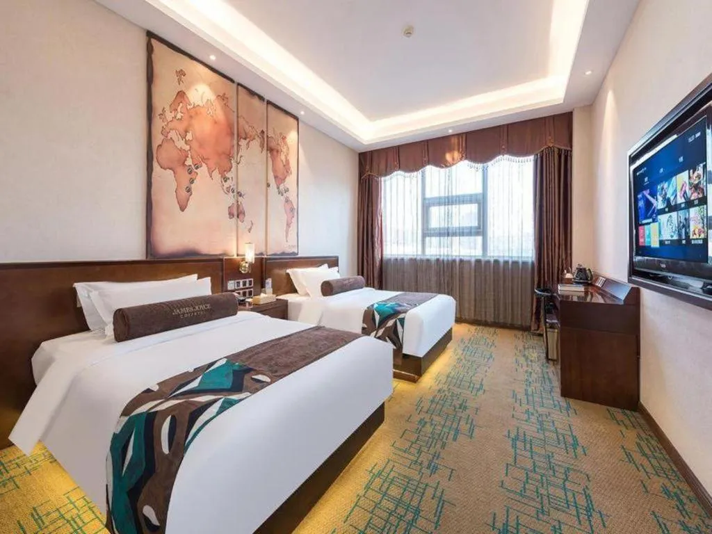 Bed in James Joyce Coffetel· Tianjin Olympic Center Lingbin Road Metro Station