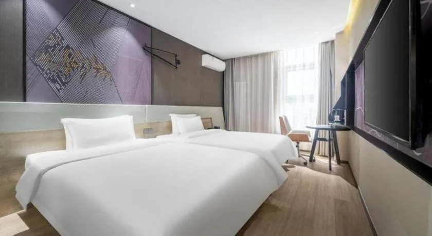 Bed in IU Hotels· Tianjin Houtai Chengjian University Haitai Industrial Park