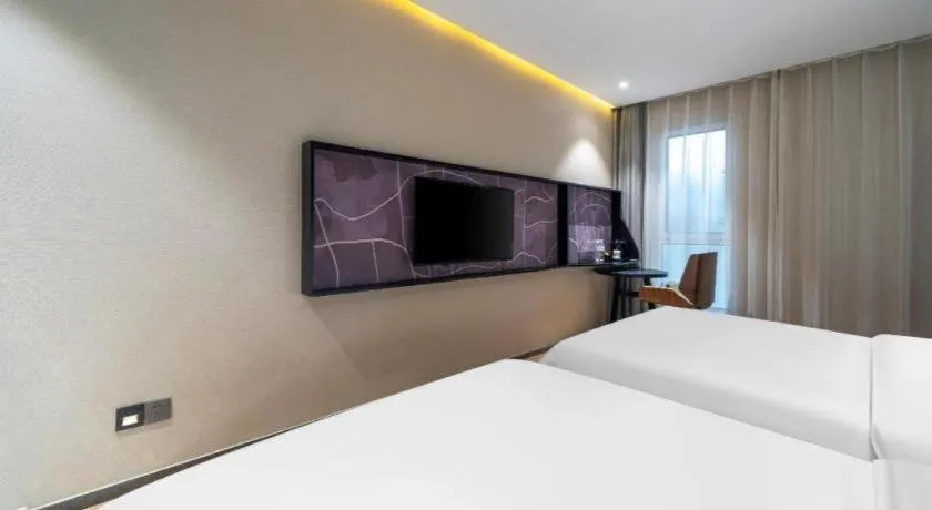 Bed in IU Hotels· Tianjin Houtai Chengjian University Haitai Industrial Park