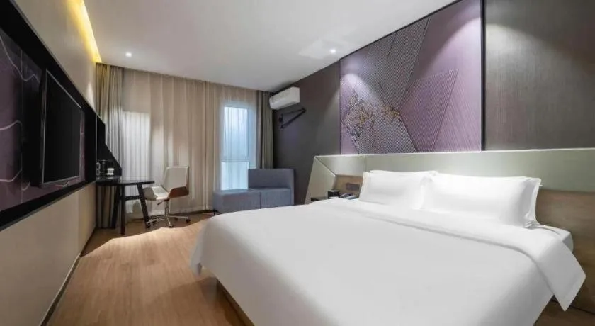 Bed in IU Hotels· Tianjin Houtai Chengjian University Haitai Industrial Park