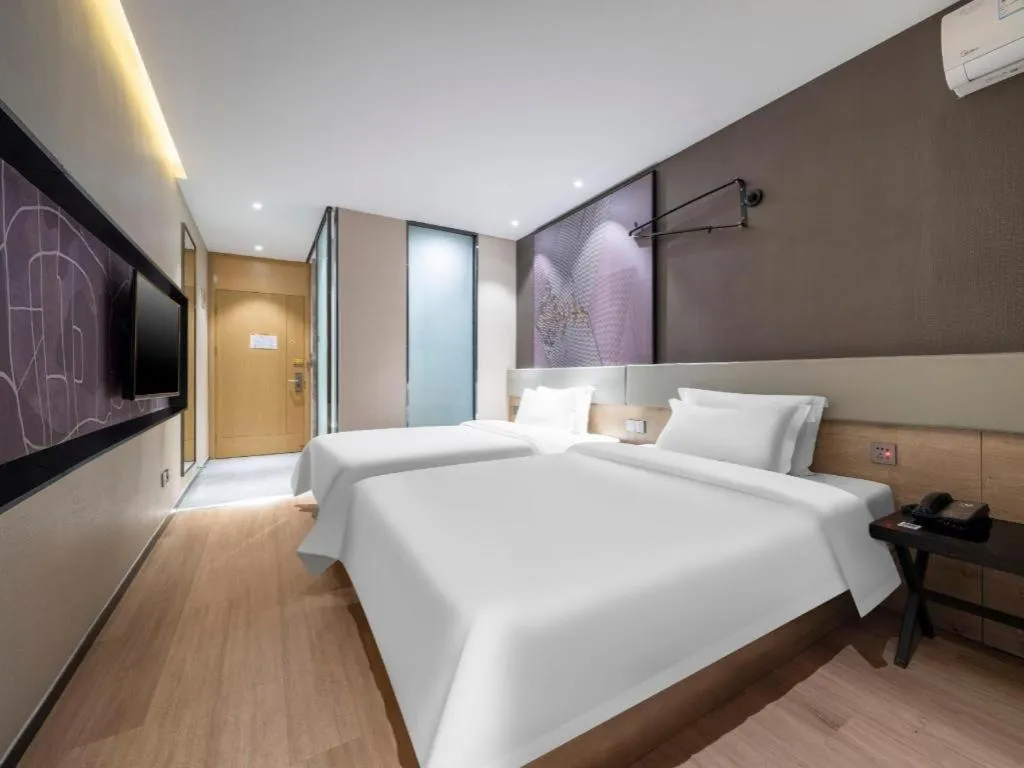 Bed in IU Hotels· Tianjin Houtai Chengjian University Haitai Industrial Park