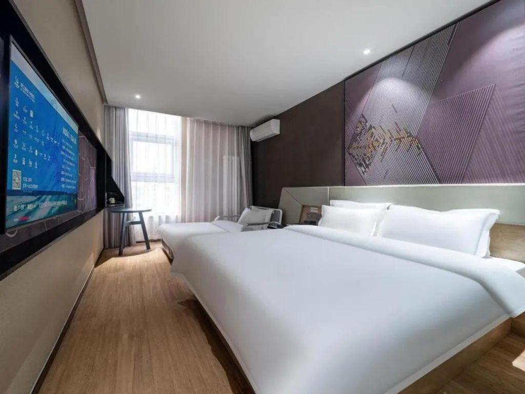 Bed in IU Hotels· Tianjin Houtai Chengjian University Haitai Industrial Park