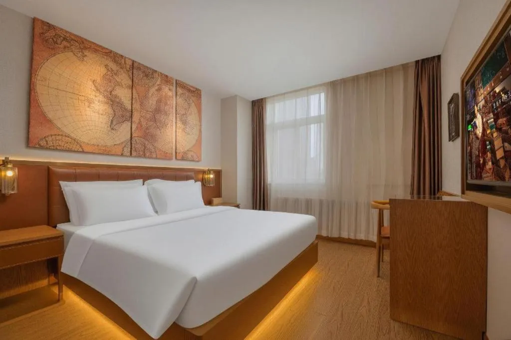 Bed in James Joyce Coffetel Shijiazhuang the Mixc Jinyuan Tower Airport Bus
