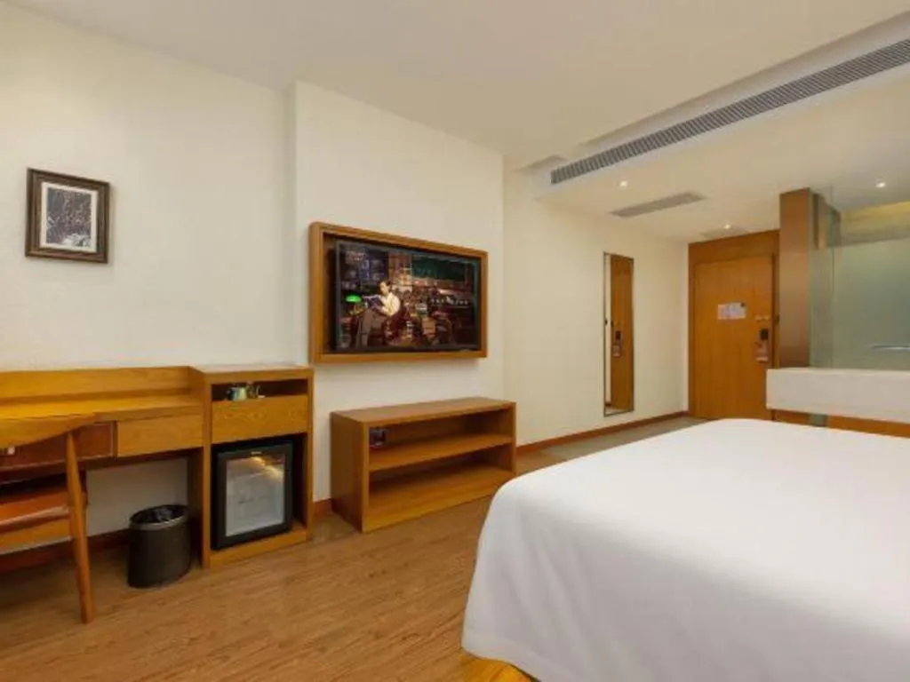 Bed in James Joyce Coffetel Shijiazhuang the Mixc Jinyuan Tower Airport Bus